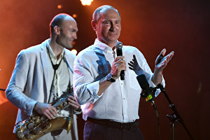 Russian President Vladimir Putin attends Koktebel Jazz Party 2017 festival. Left: saxophonist Sergei Golovnya